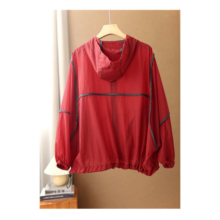 Women's lightweight hoodie jacket with elastic hem and reflective details Chic & Stil