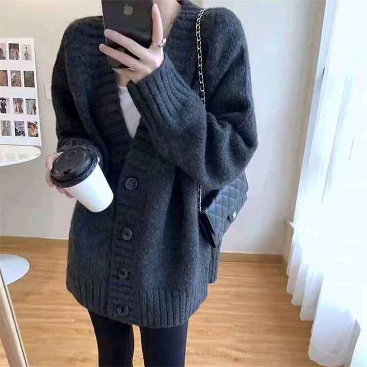 Ladies chunky knit cardigan with voluminous sleeves and buttoned neckline Lune London