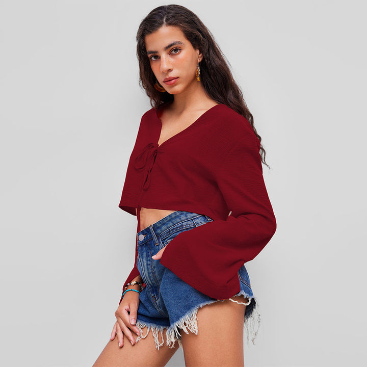Haut court femme avec un profond décolleté en V et un nœud ludique Chic & Stil