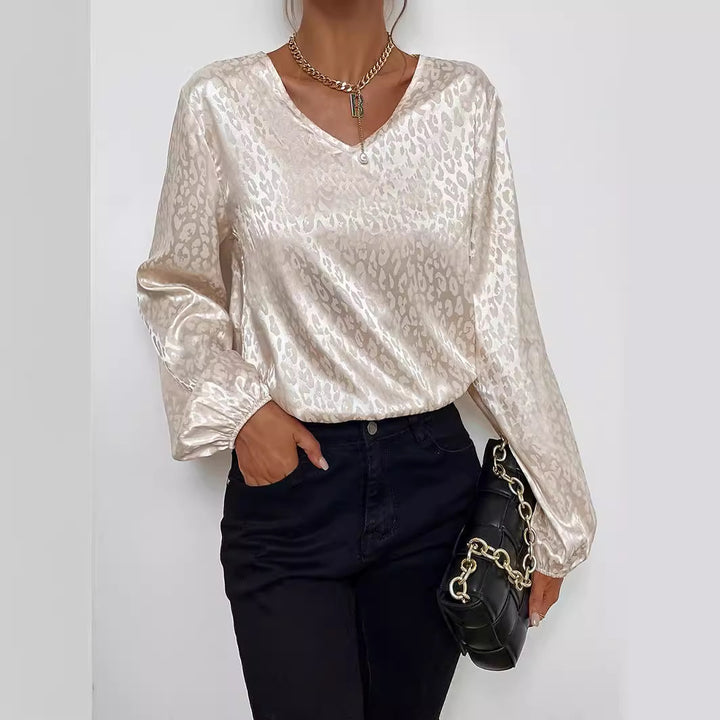 Blouse élégante pour femmes avec col en V et manches volumineuses Chic & Stil
