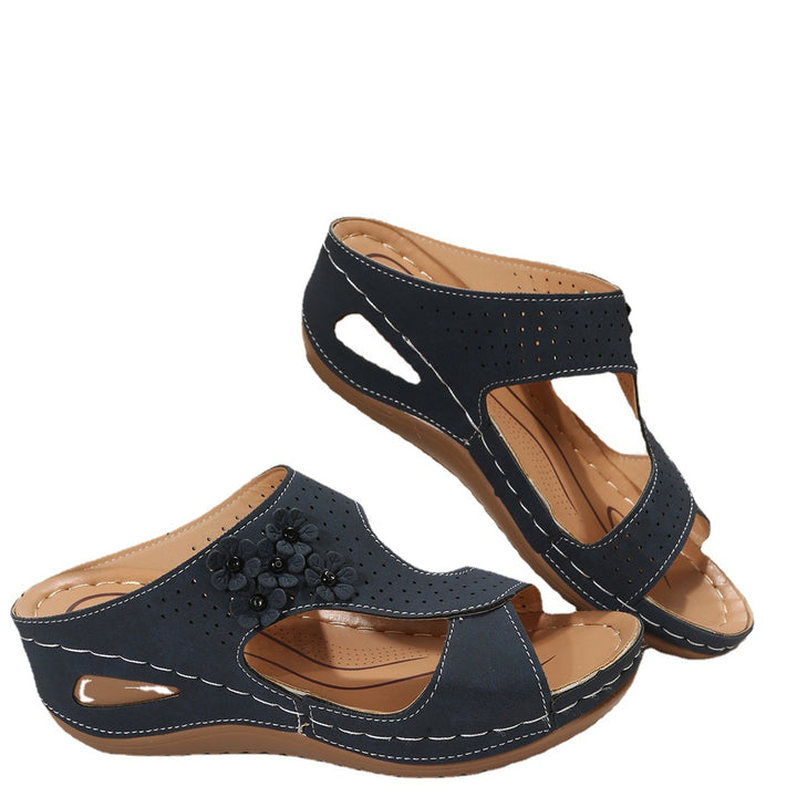 Comfortable wedge sole sandals for women with an airy surface structure and elastic straps Lune London