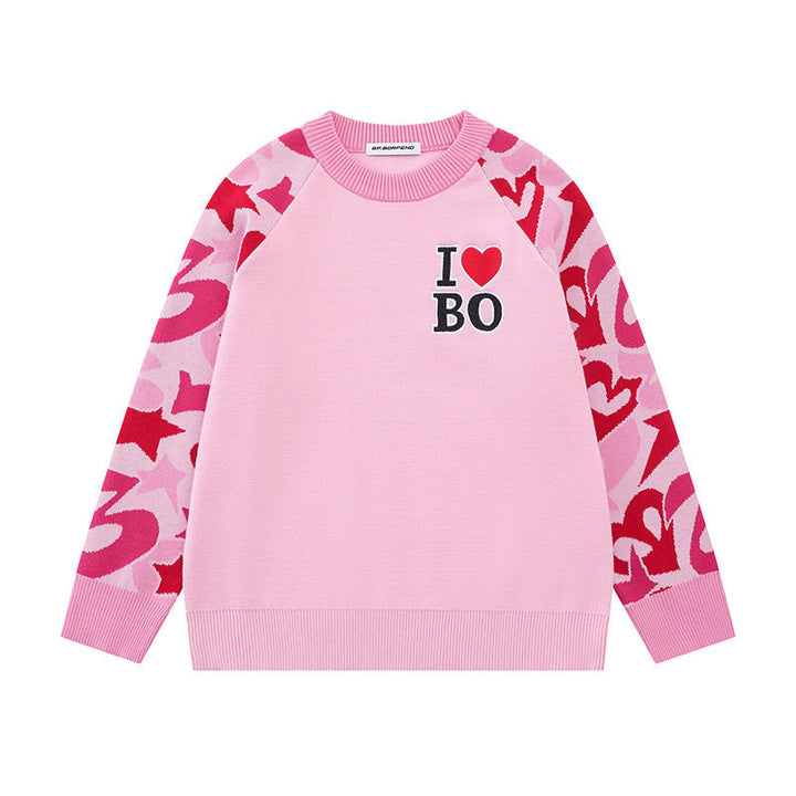 Women's knit sweater with raglan sleeves, statement jacquard sleeves, and ribbed hem Amarae