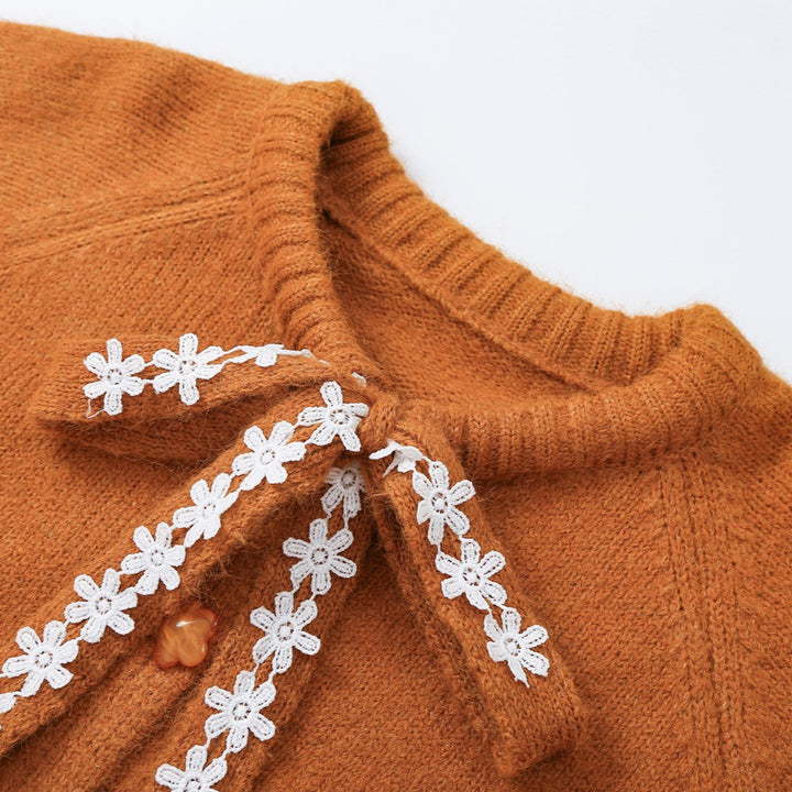 Women's chunky knit pullover with floral lace trim at the neckline Amarae