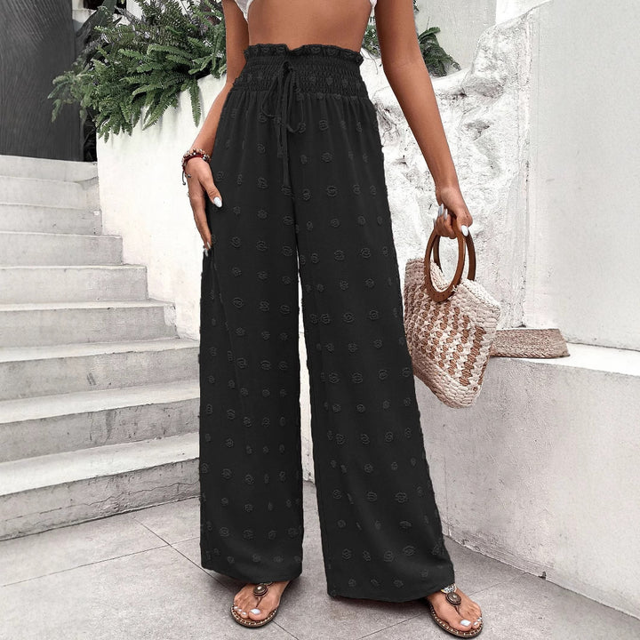 Wide palazzo pants for women with elastic waistband and decorative pattern Lune London