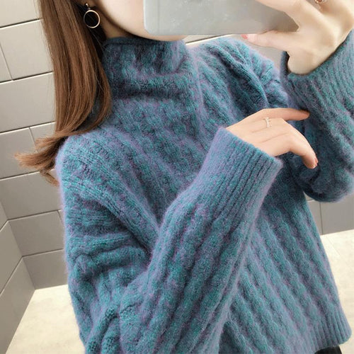Knitted sweater for women with a modern ribbed design featuring a high collar and relaxed sleeves Amarae