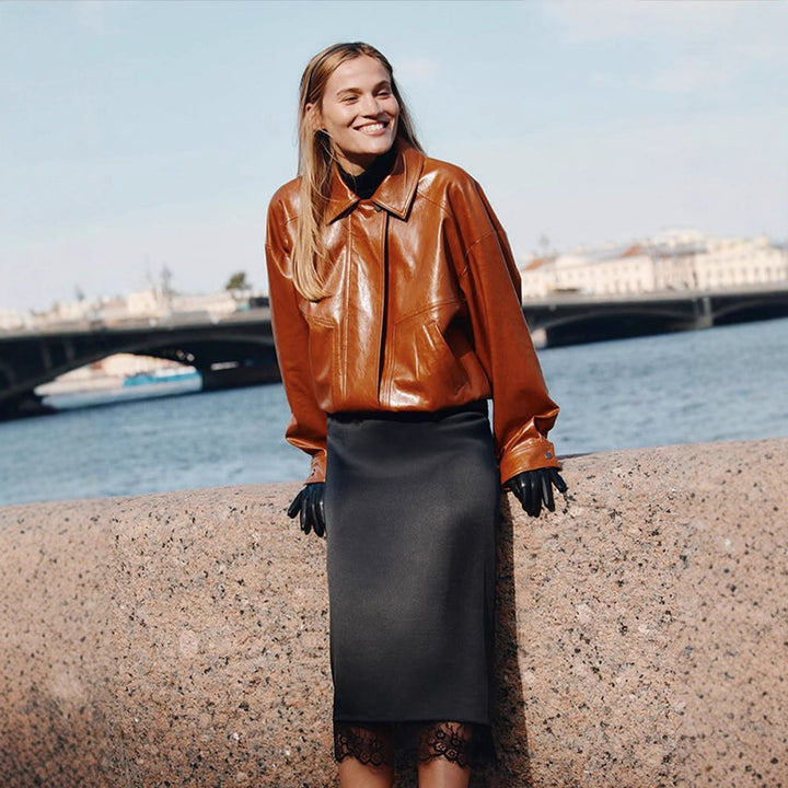 Women's short blazer made of vegan smooth leather with boxy silhouette and concealed snap button placket Amarae