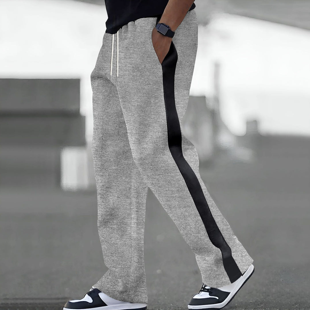 Trendy sports pants for men with elastic waistband and contrasting side stripes Lune London