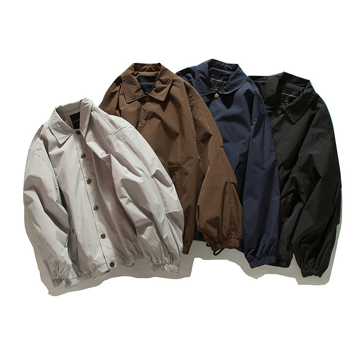 Unisex Boxy transitional bomber jacket with drawstring hem and snap button placket Amarae