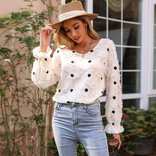 Tunique féminine à la mode avec un motif floral décoratif et des manches bouffantes Chic & Stil
