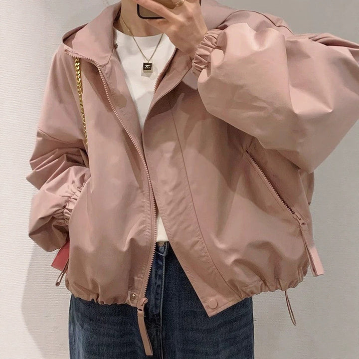 Women's oversized bomber-style hooded jacket with drawstring, elastic cuffs, and side zip pockets Amarae