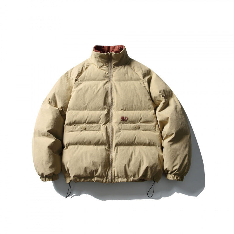 Unisex Boxy padded stand collar puffer jacket with drawstring hem and flap pockets Amarae