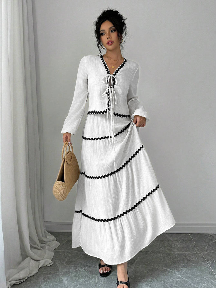Maxi dress for women with playful lace-up neckline and elegant ruffled skirt Lune London
