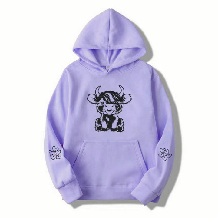 Women's hooded sweatshirt with charming cow motif and practical kangaroo pockets Lune London