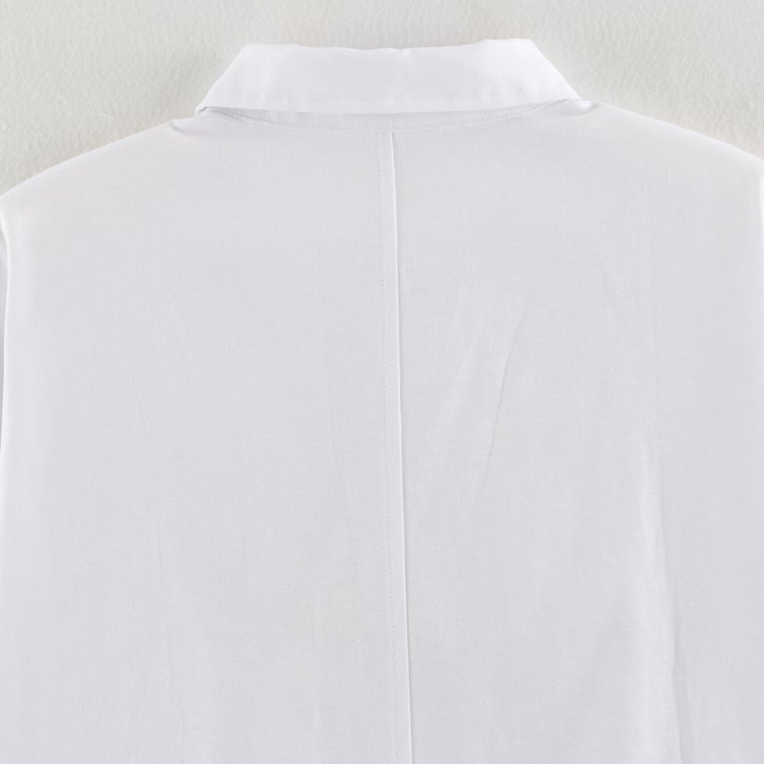 Women's blouse with long sleeves and decorative frog jewelry as well as concealed button placket