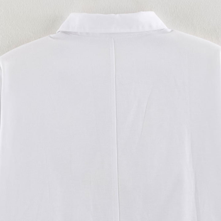 Women's blouse with long sleeves and decorative frog jewelry as well as concealed button placket
