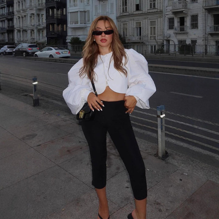Women short-cut blouse with curved hem edge and voluminous puff sleeves Amarae