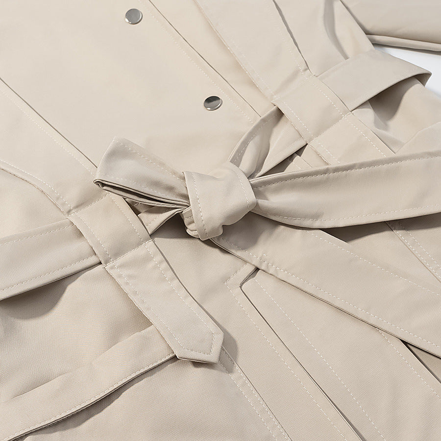 Ladies short trench coat with cape detail, stand-up collar and tie belt Amarae