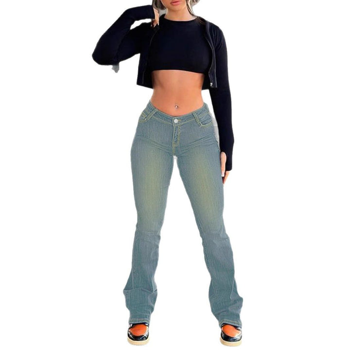 Women's waist-fitting stretch bootcut jeans with sculpting V waistband and extended hem Amarae