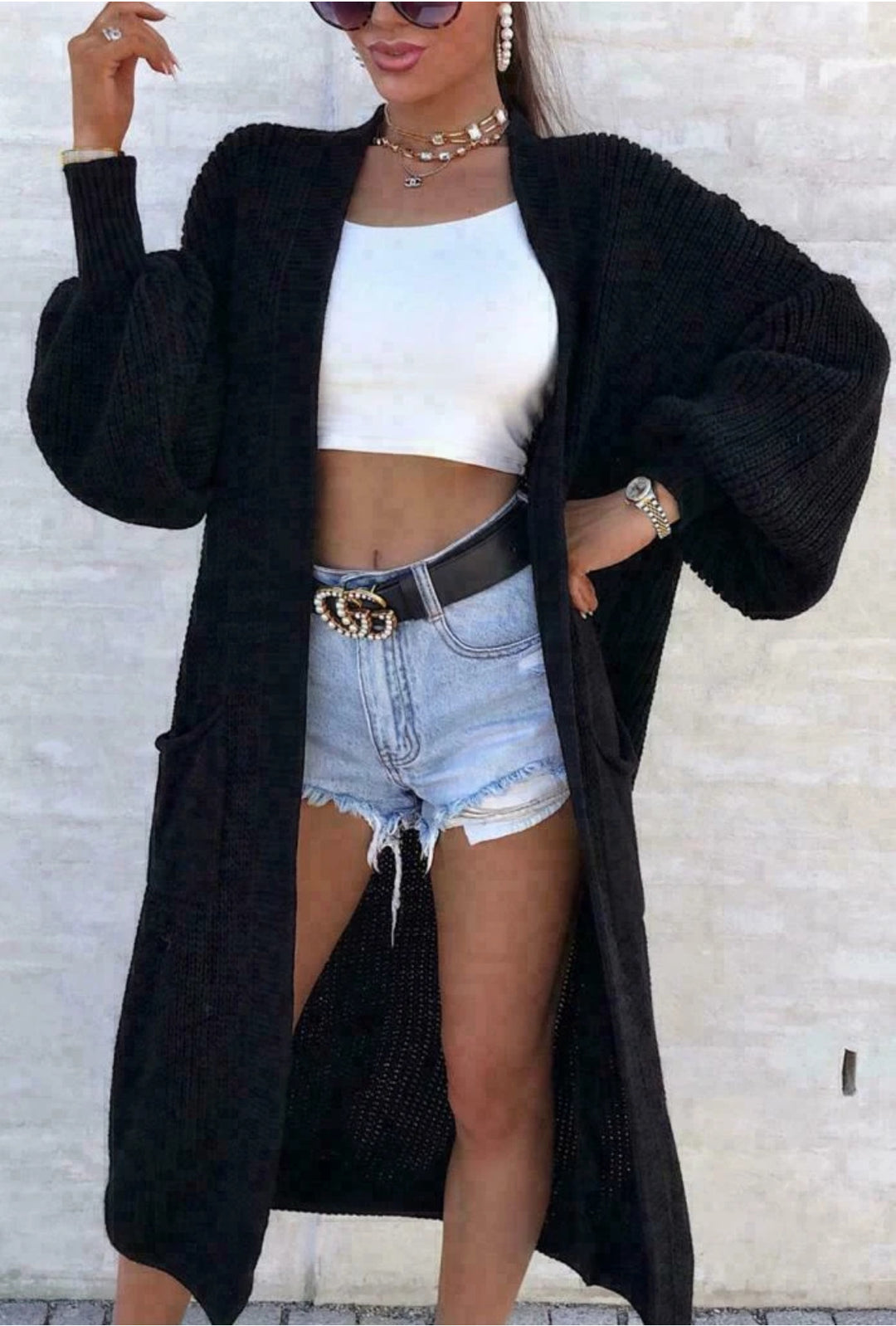 Long knitted coat for women with oversized sleeves and practical pockets Lune London