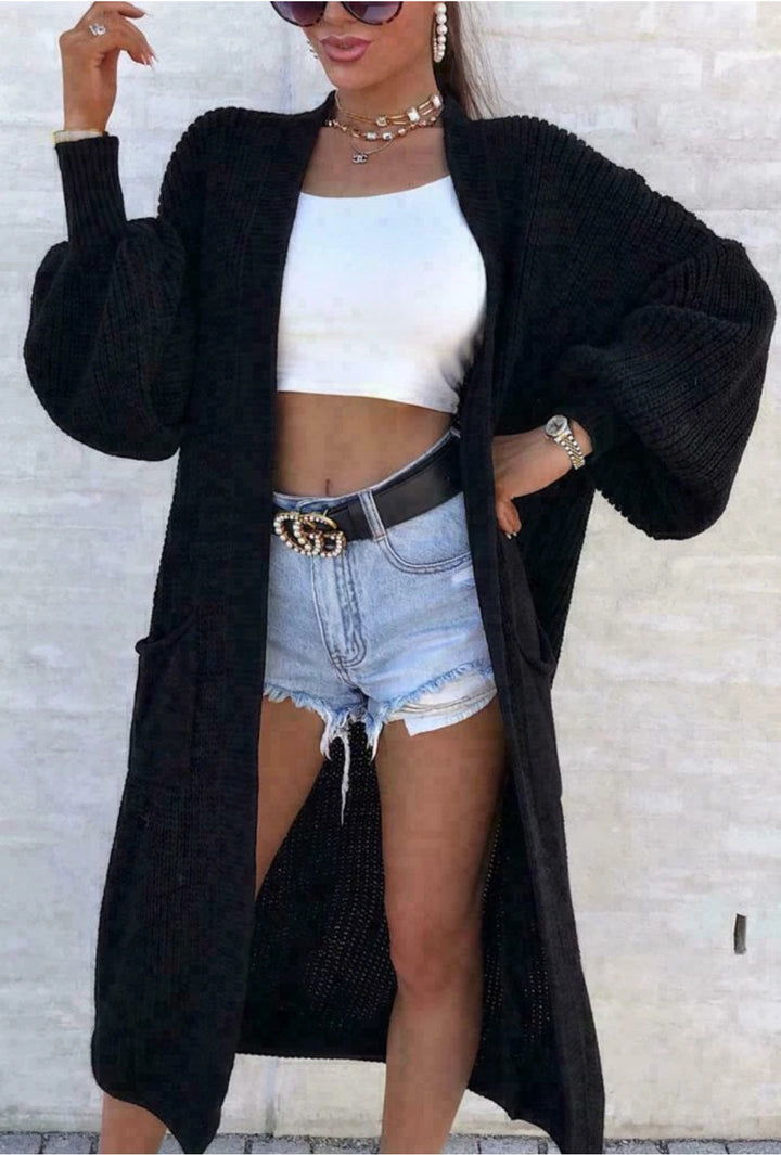 Long knitted coat for women with oversized sleeves and practical pockets Lune London