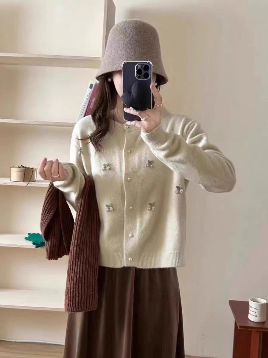 Women's knit jacket with a playful design and chic pearl buttons