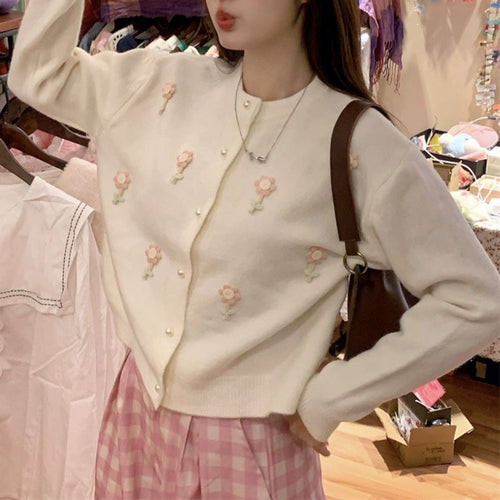Knit jacket for women with elaborate floral appliqués and elegant pearl buttons Amarae
