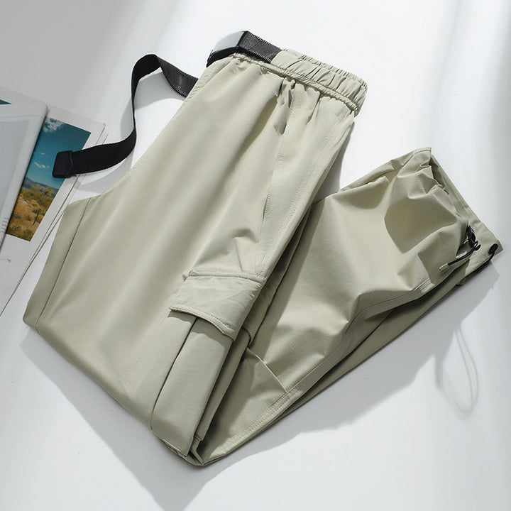 Men's cargo joggers with elastic waistband, drawstring, adjustable leg cuffs, and patch pockets.