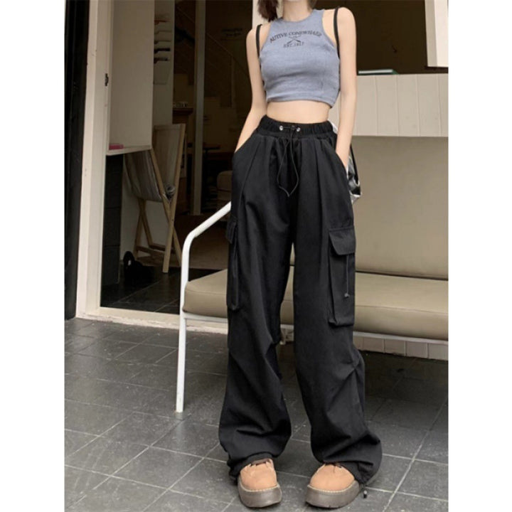 Women's cargo trousers with side pockets and elastic waistband Chic & Stil