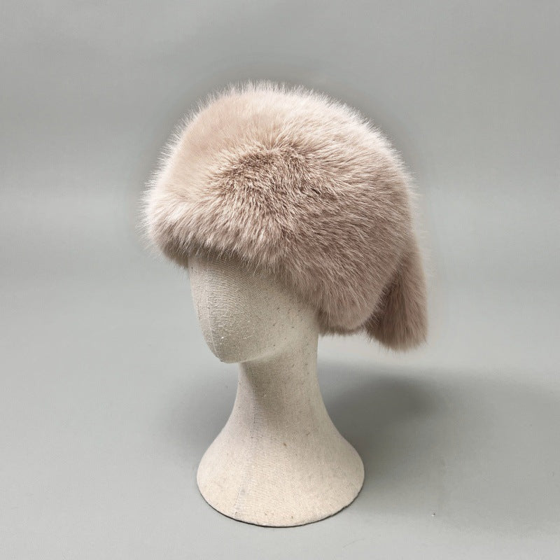 Women’s plush faux fur trapper hat with earflaps and decorative tail Amarae