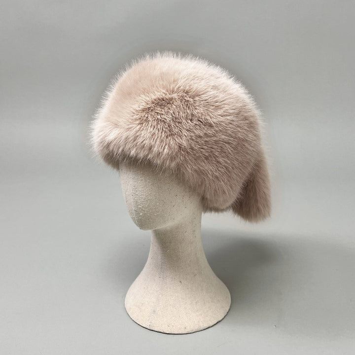 Women’s plush faux fur trapper hat with earflaps and decorative tail Amarae