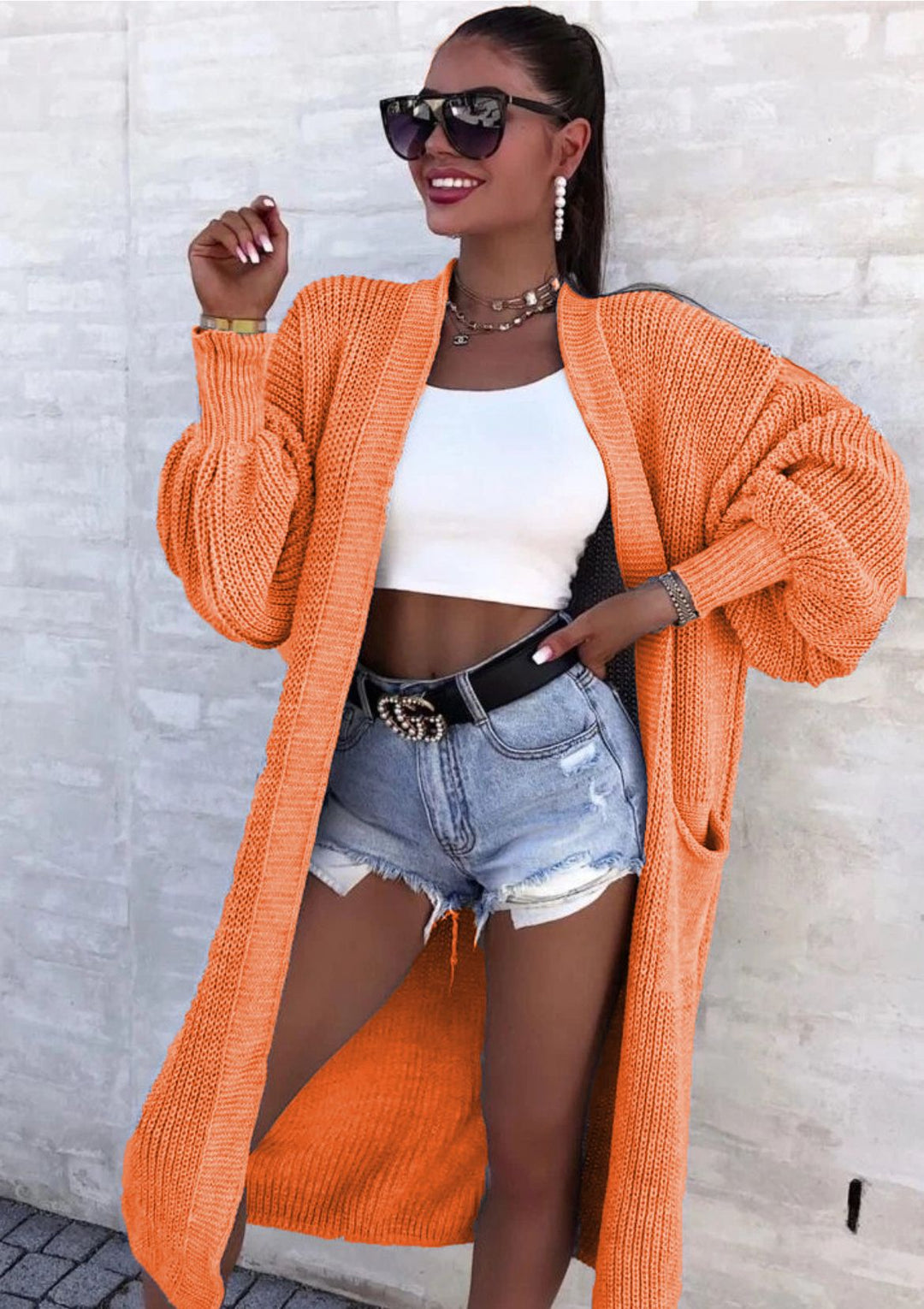 Long knitted coat for women with oversized sleeves and practical pockets Lune London
