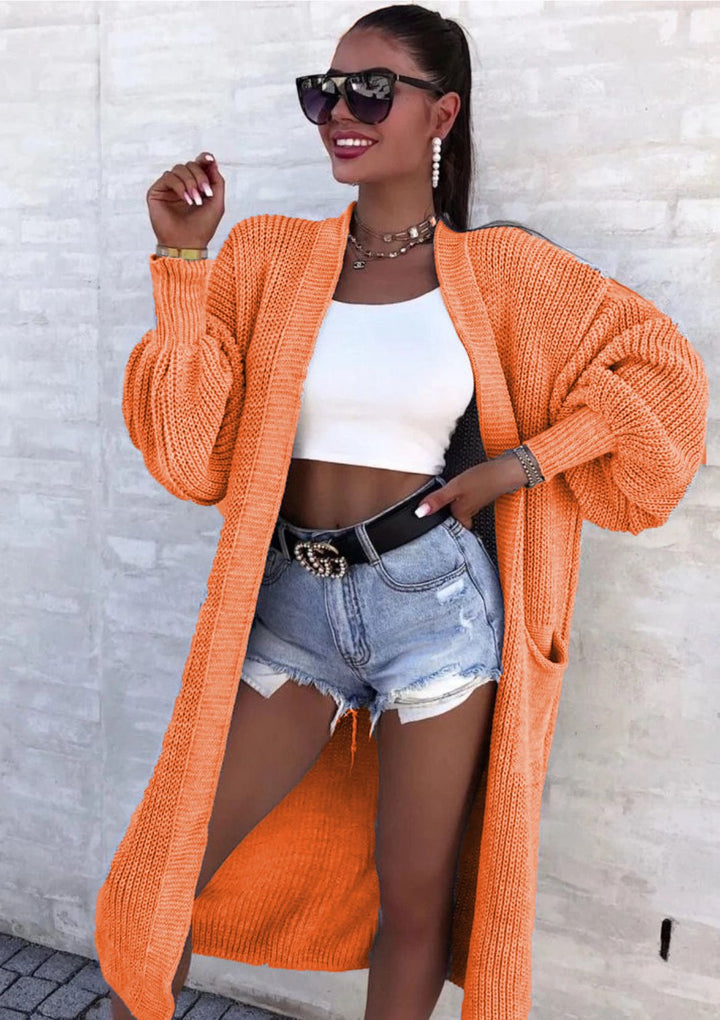 Long knitted coat for women with oversized sleeves and practical pockets Lune London