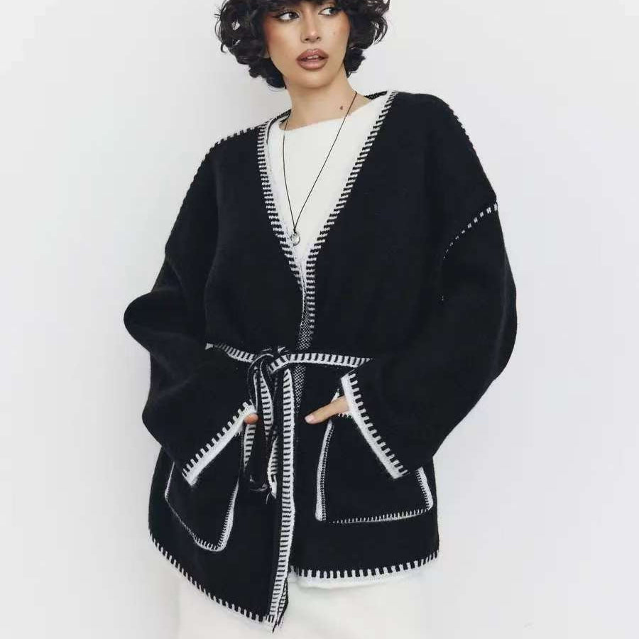 Thick knitted coat for women with practical belt and pockets Lune London