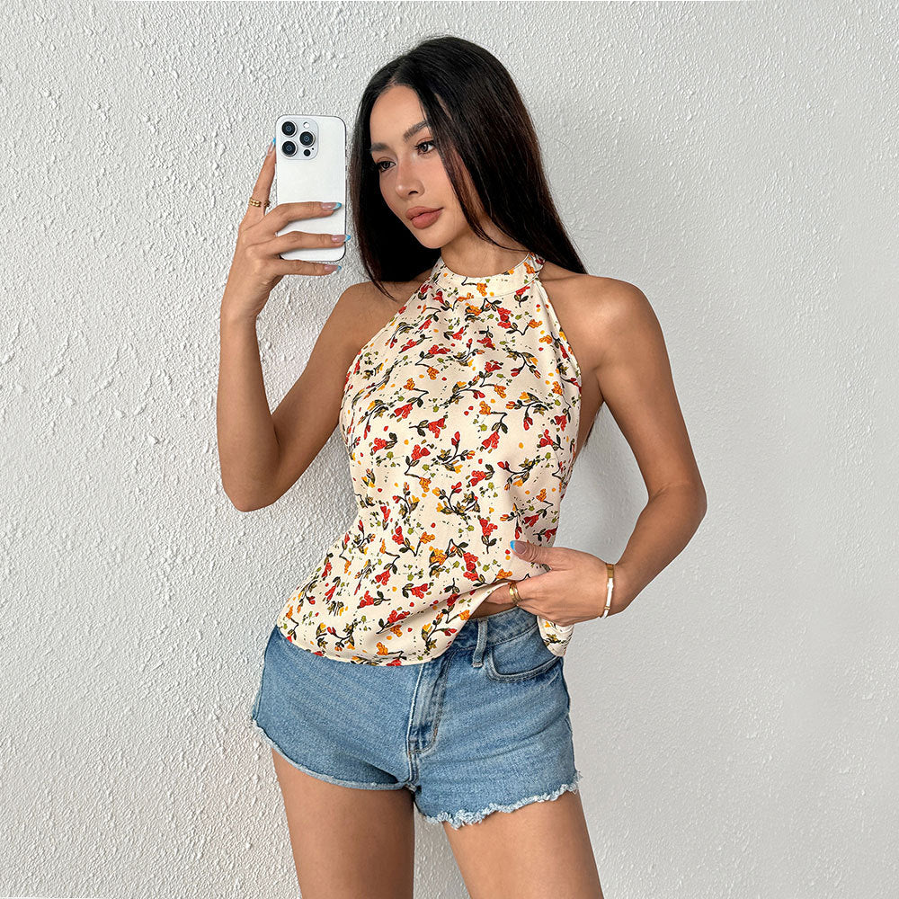Haut à bretelles féminin avec design floral et ourlet flottant Chic & Stil