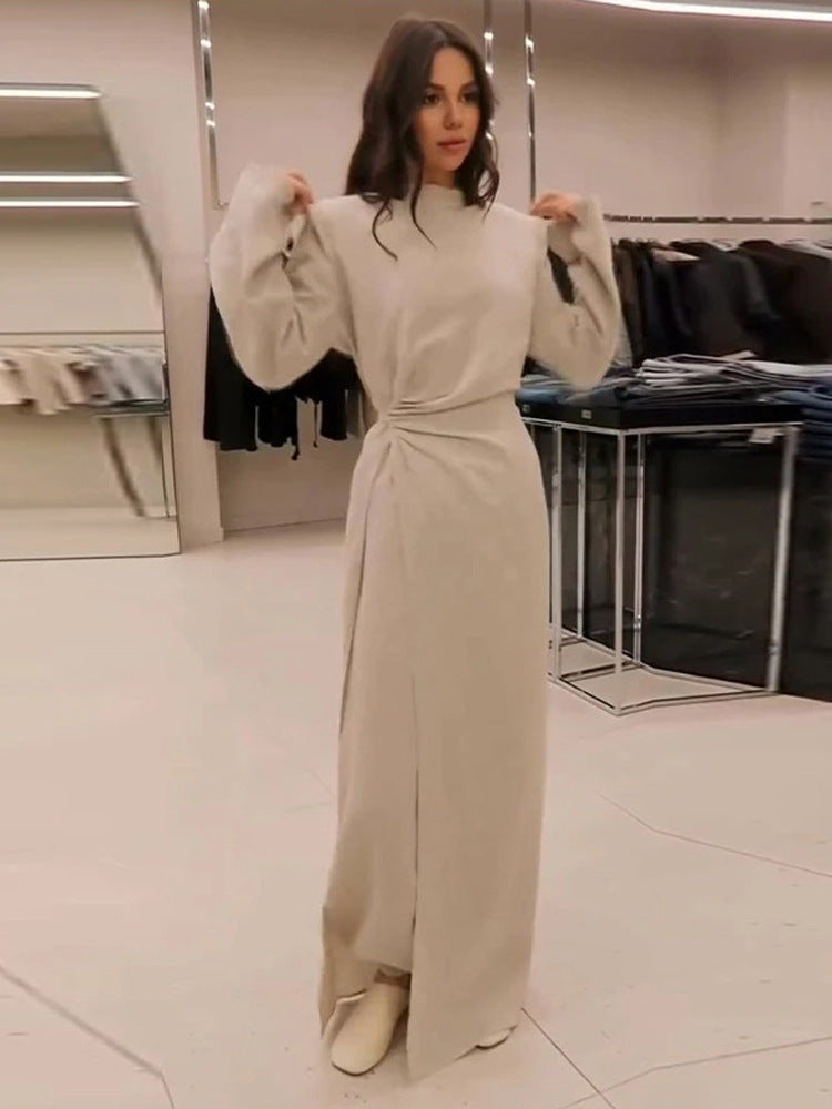 Women’s maxi dress with tailored silhouette, flared skirt and striking shoulders Amarae