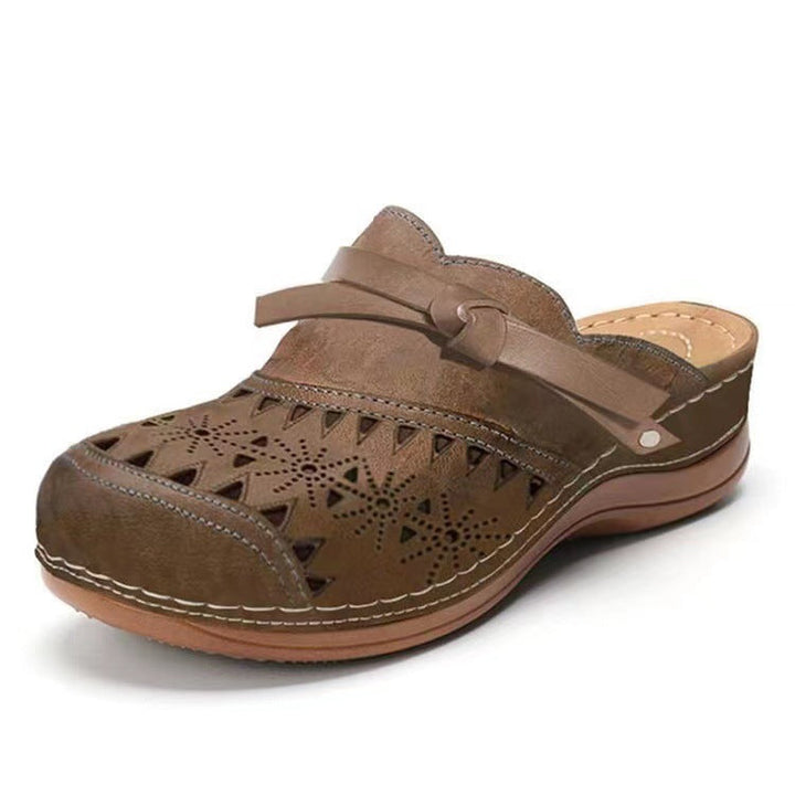 Women's Comfortable Clogs with Filigree Cutout Design and Elegant Strap Lune London