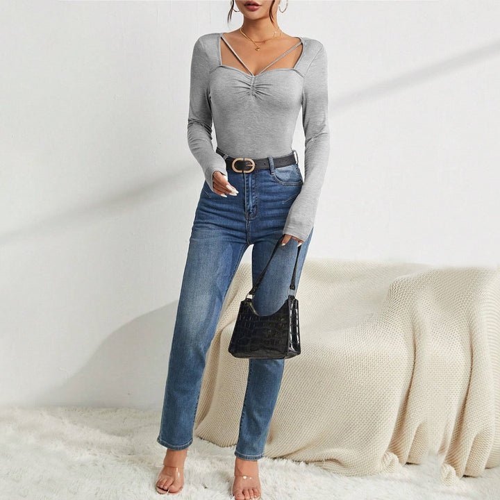 Body à manches longues pour femme avec décolleté en V tendance et détails raffinés aux épaules Chic & Stil