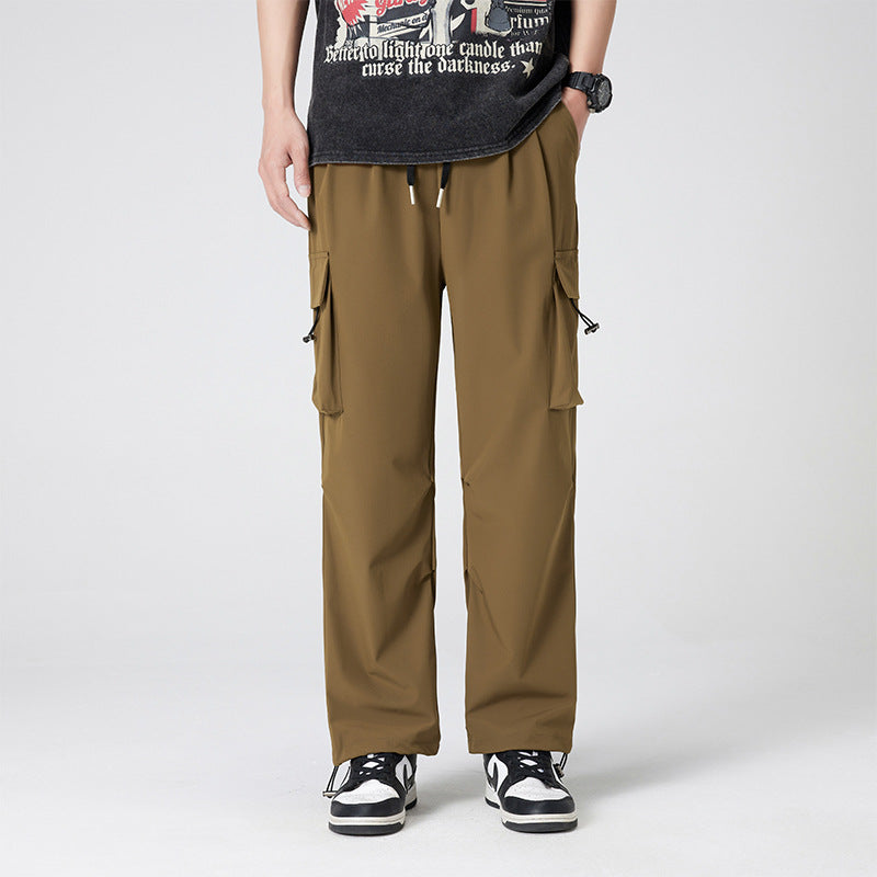 Women’s cargo pants in outdoor style with drawstring waistband, large side pockets, and adjustable hem.