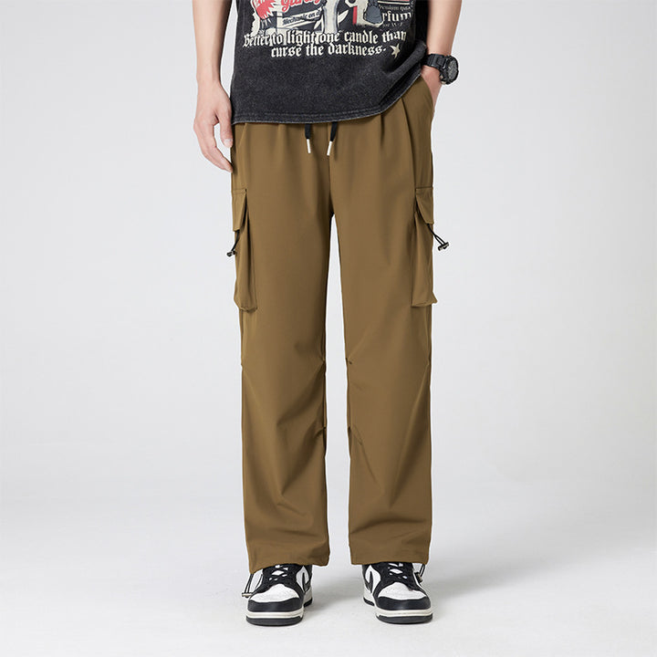Women’s cargo pants in outdoor style with drawstring waistband, large side pockets, and adjustable hem.