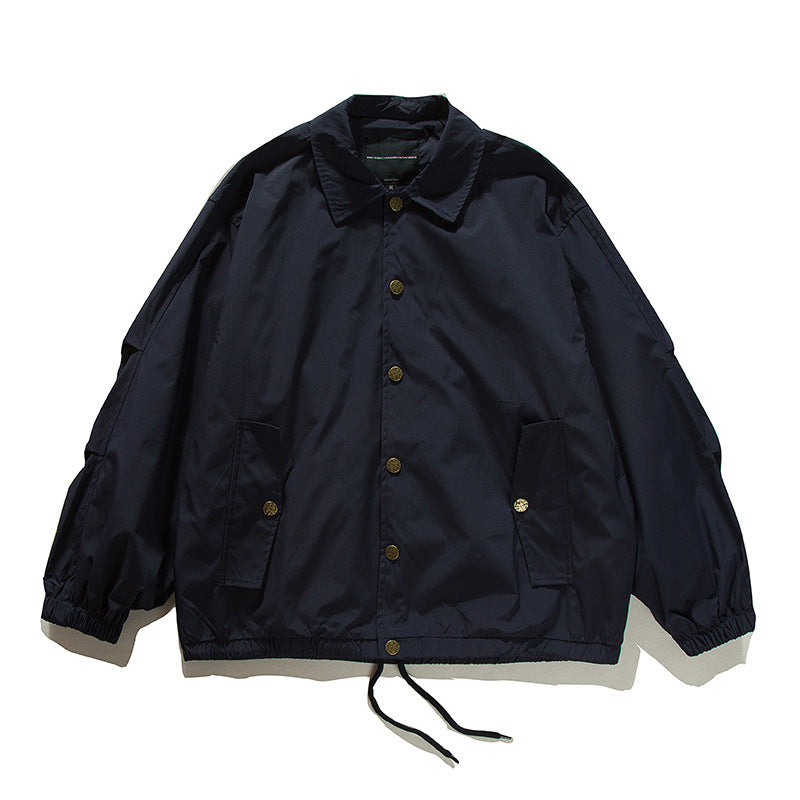 Unisex Boxy transitional bomber jacket with drawstring hem and snap button placket Amarae