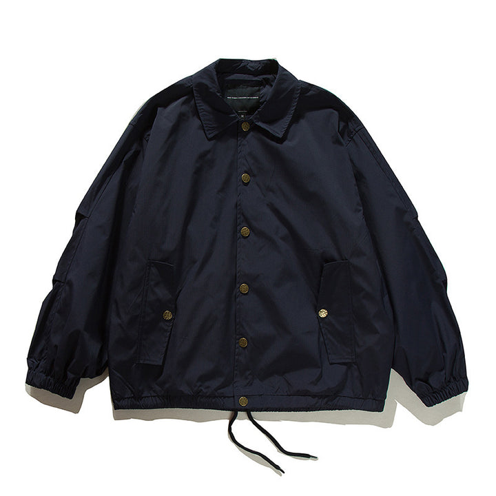 Unisex Boxy transitional bomber jacket with drawstring hem and snap button placket Amarae