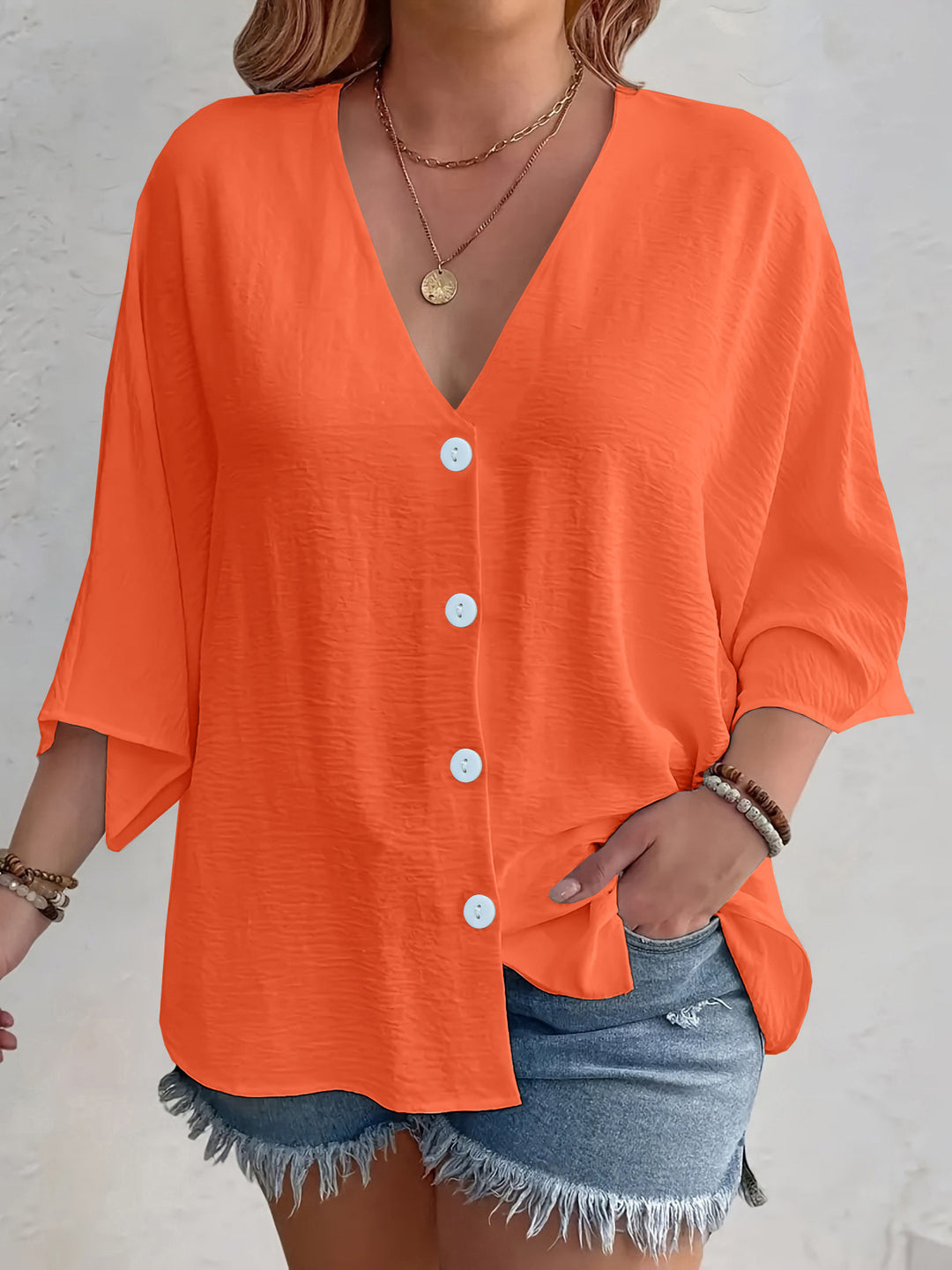 Short-sleeved advantageous blouse for ladies with button placket and V neckline Lune London
