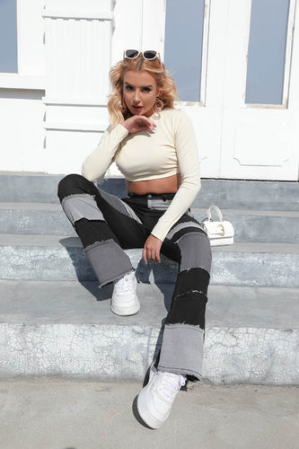 Women's bootcut jeans with a modern patchwork design and casual fringes Amarae