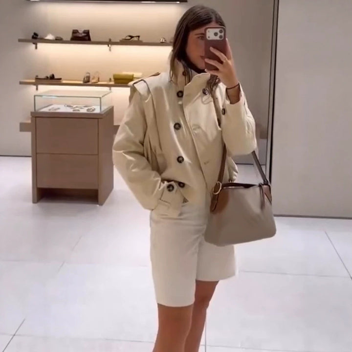 Women's tailored short trench coat with double-breasted style, stand collar and shoulder flaps Amarae