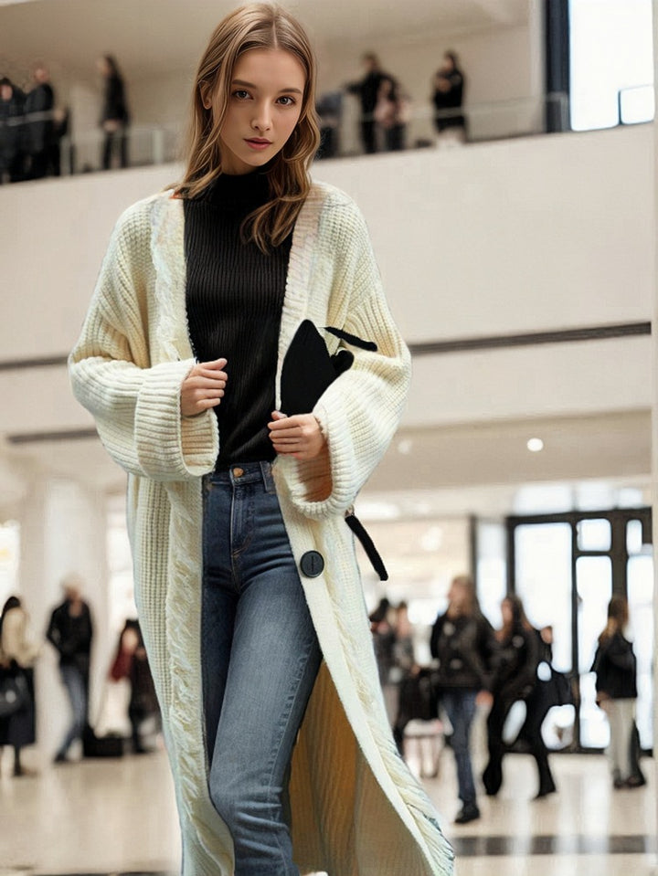 Ladies chunky knitted cardigan with fringed details and an open cut Lune London