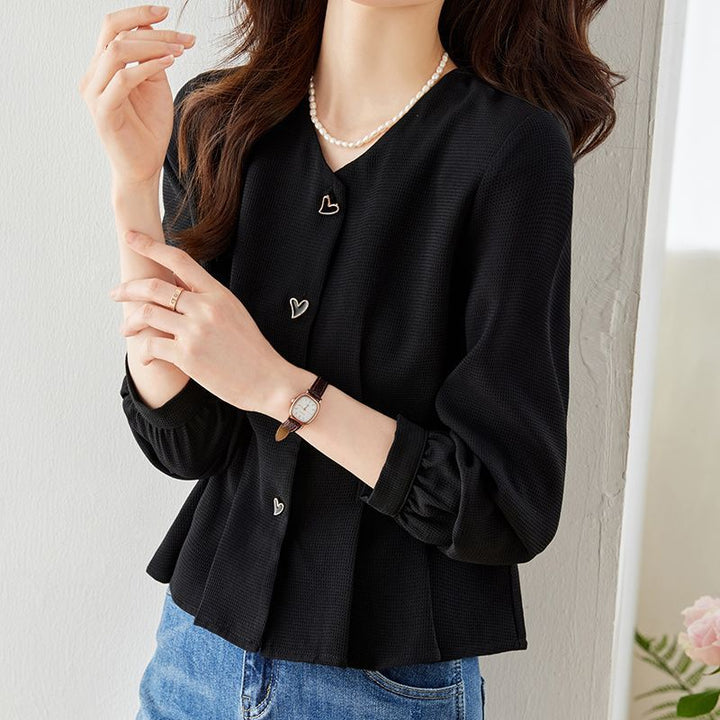 Blouse élégante pour femmes avec des détails de bouton en forme de cœur et des manches volumineuses Chic & Stil