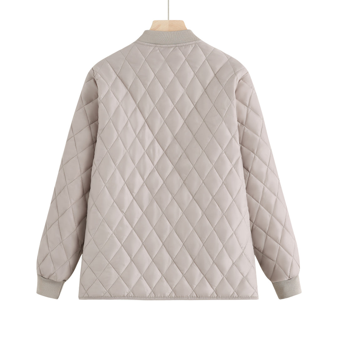Women's quilted transition jacket with practical pockets and elastic cuffs Lune London