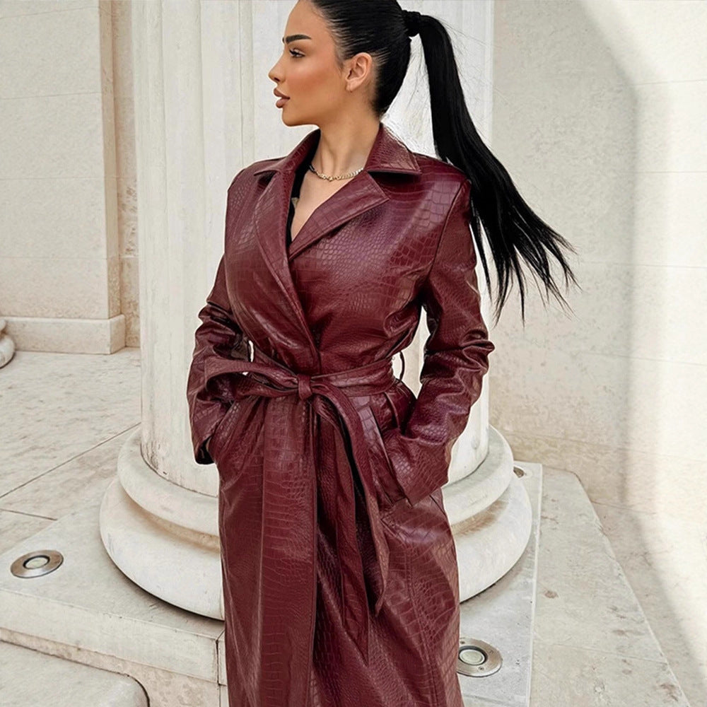 Women's long coat made of faux leather with crocodile embossing and waist belt Amarae