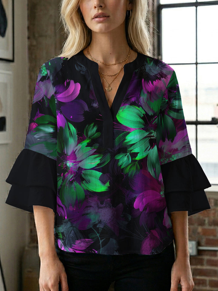 Women’s blouse with voluminous ruffled sleeves and floral pattern Lune London