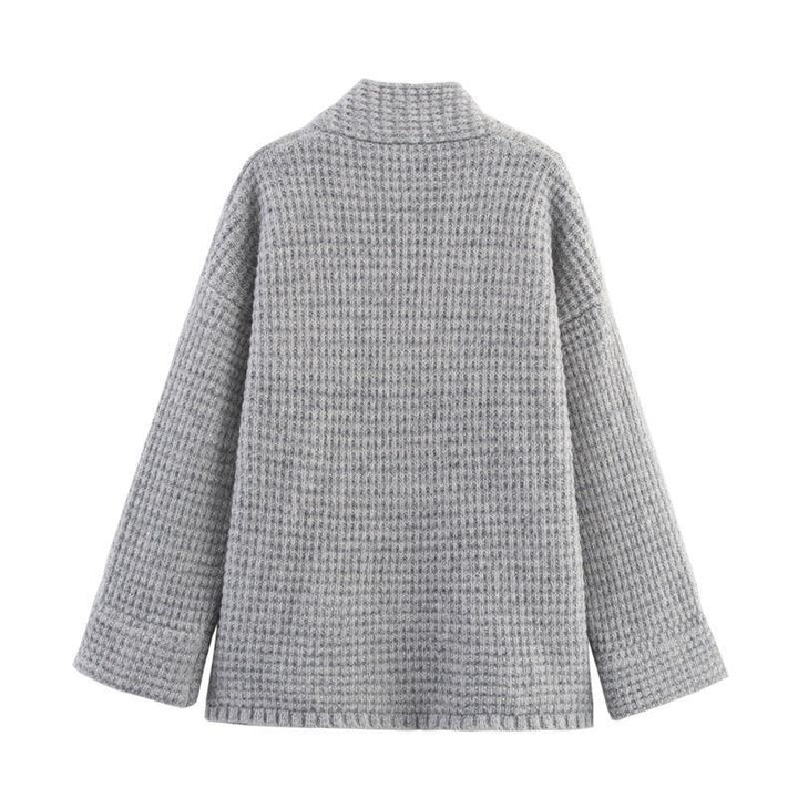 Ladies quilted knit with decorative button closure and high collar Lune London